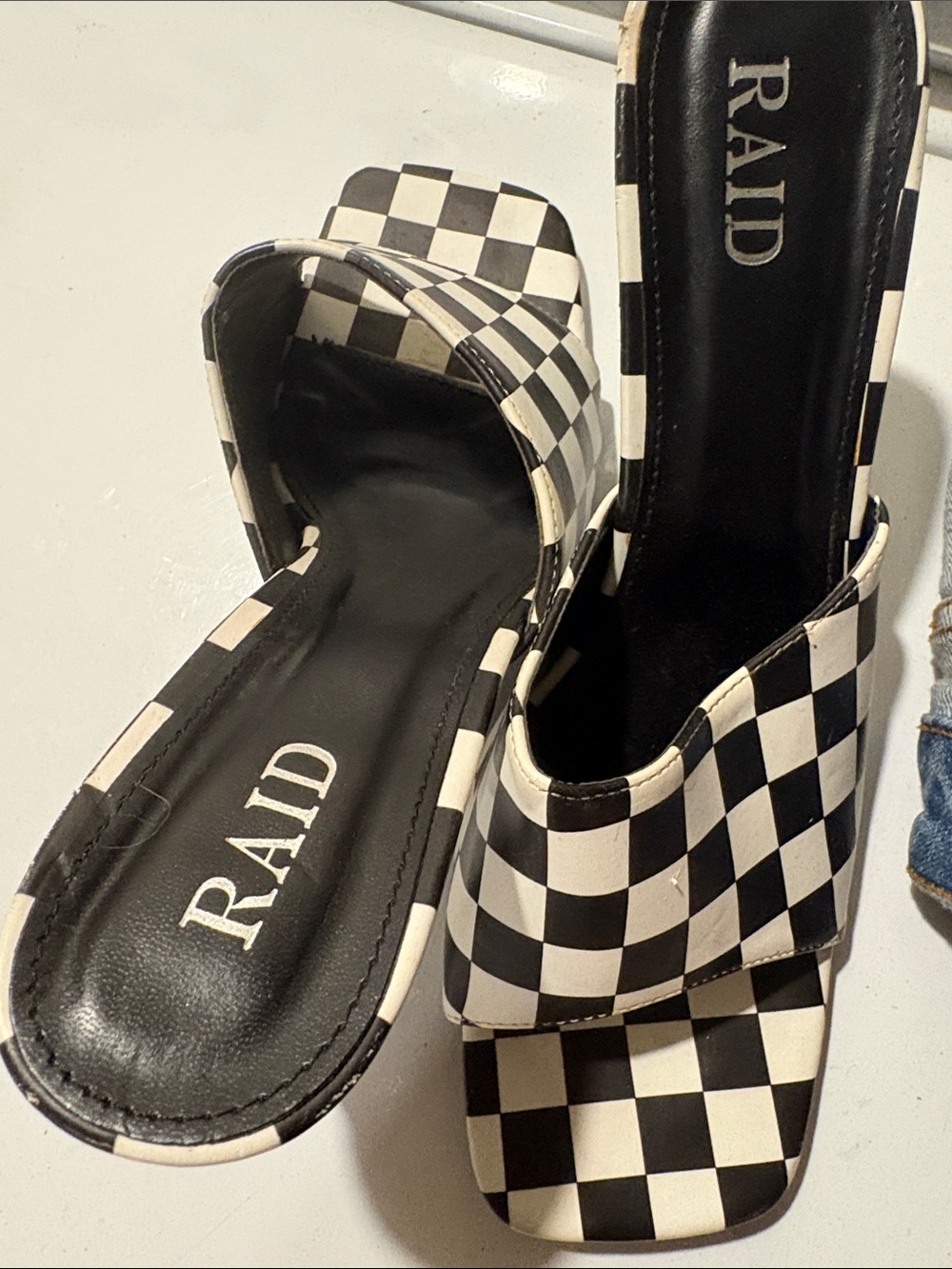 RAID Black & White Check Slide Mules